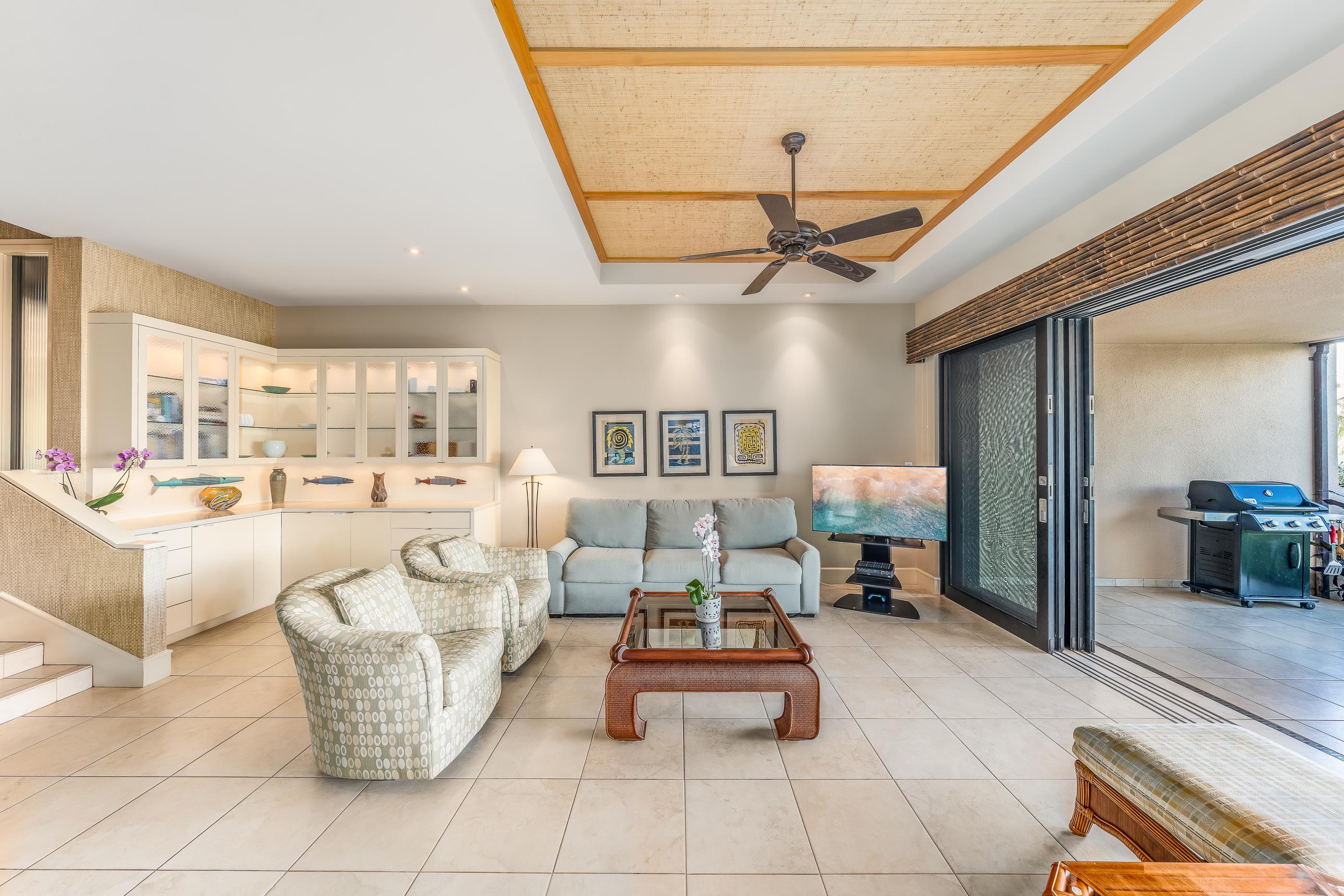 4850 Makena Alanui Road, Unit C106 Kihei, HI 96753 - Photo 17 of 49 a living room with furniture and a chandelier