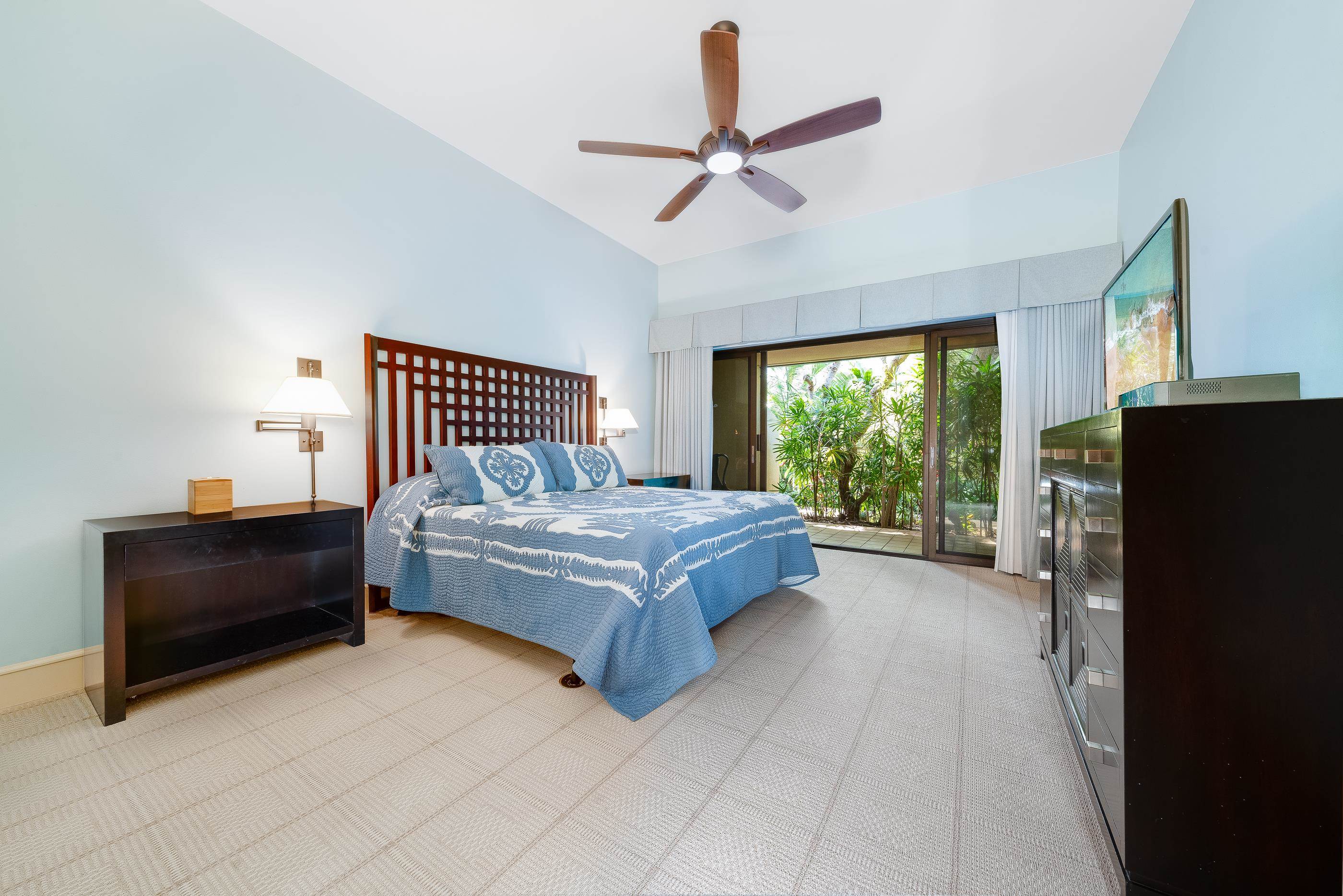 4850 Makena Alanui Road, Unit C106 Kihei, HI 96753 - Photo 21 of 49 a bedroom with a bed and a large window