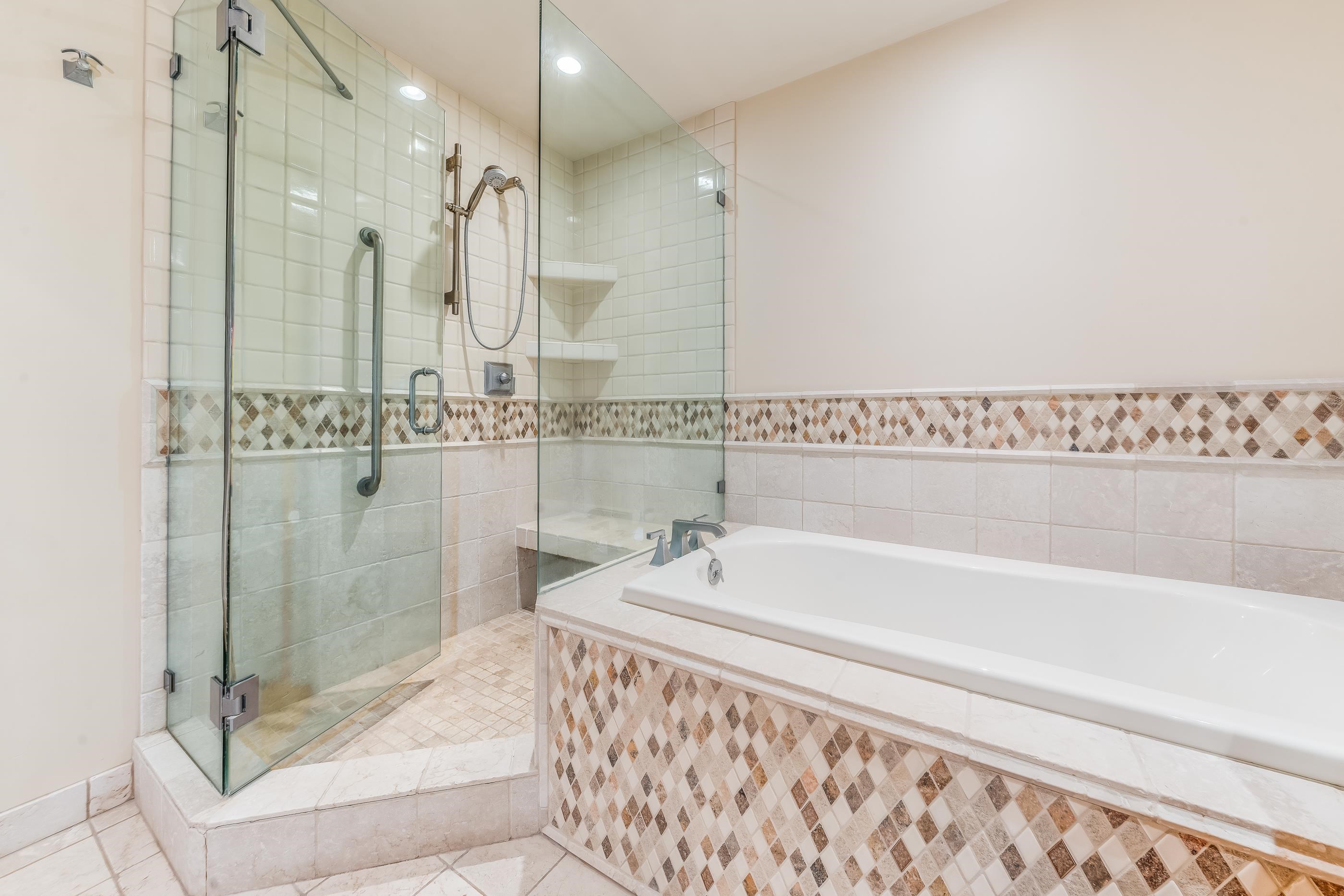 4850 Makena Alanui Road, Unit C106 Kihei, HI 96753 - Photo 23 of 49 a bathroom with a bathtub and a shower