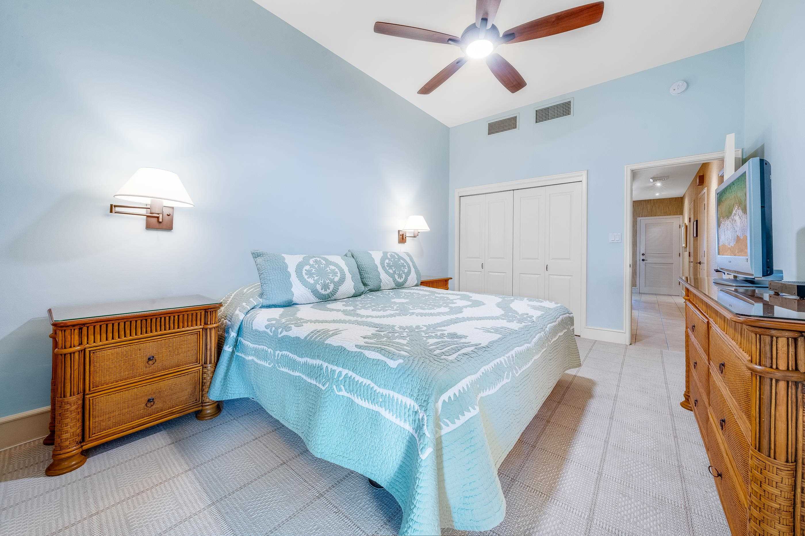 4850 Makena Alanui Road, Unit C106 Kihei, HI 96753 - Photo 26 of 49 a bedroom with a bed and a dresser