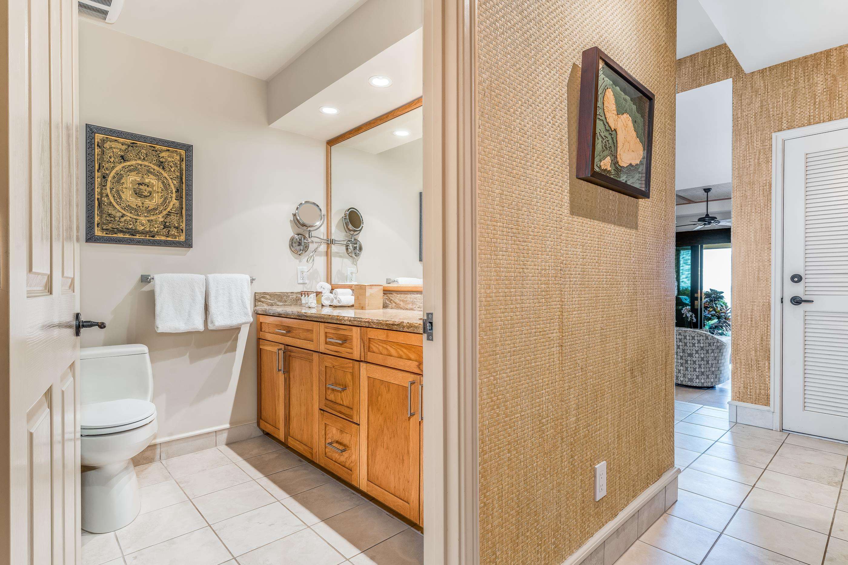 4850 Makena Alanui Road, Unit C106 Kihei, HI 96753 - Photo 27 of 49 a spacious bathroom with a granite countertop sink a toilet and a shower