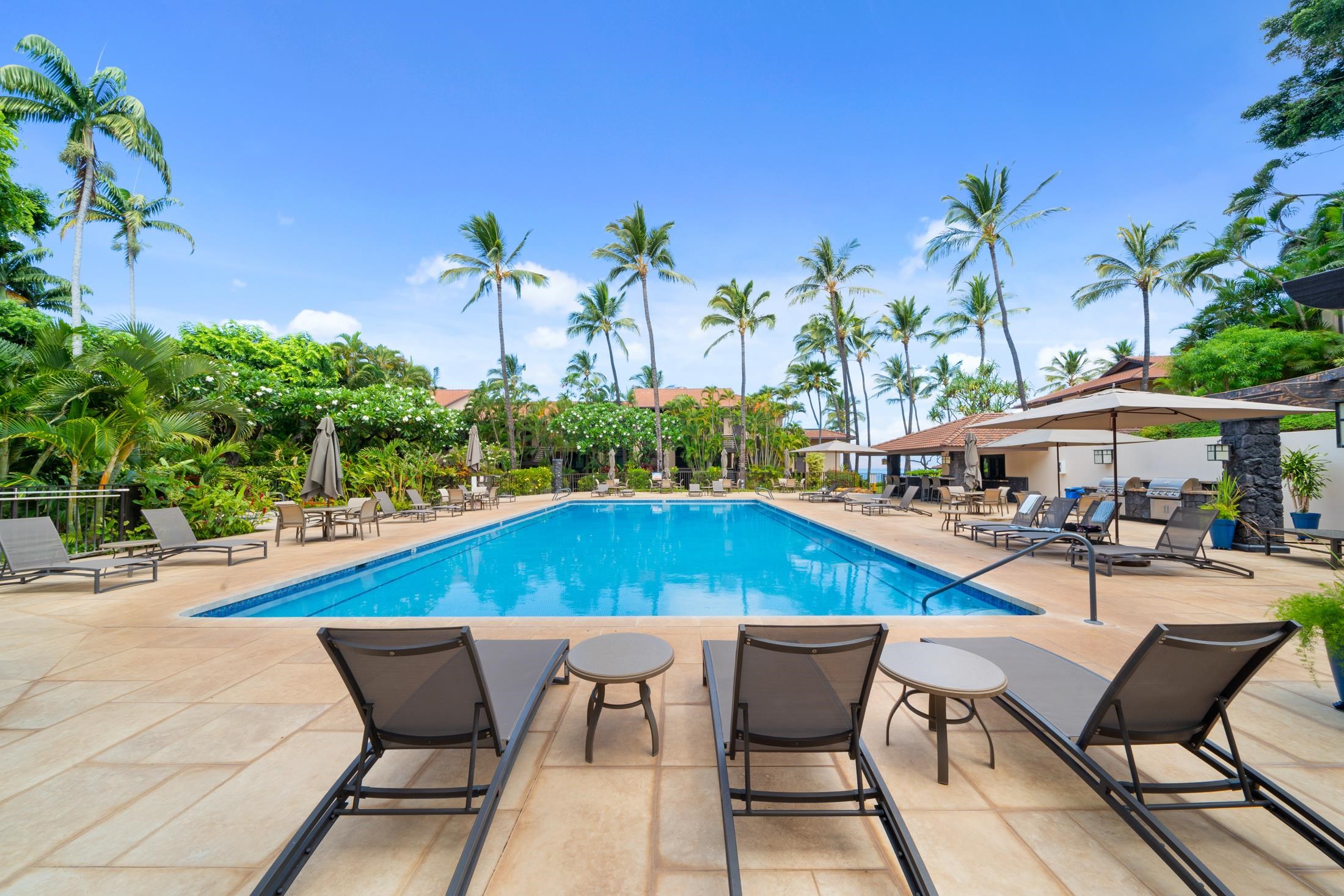 4850 Makena Alanui Road, Unit C106 Kihei, HI 96753 - Photo 37 of 49 a view of a chairs and table in the patio