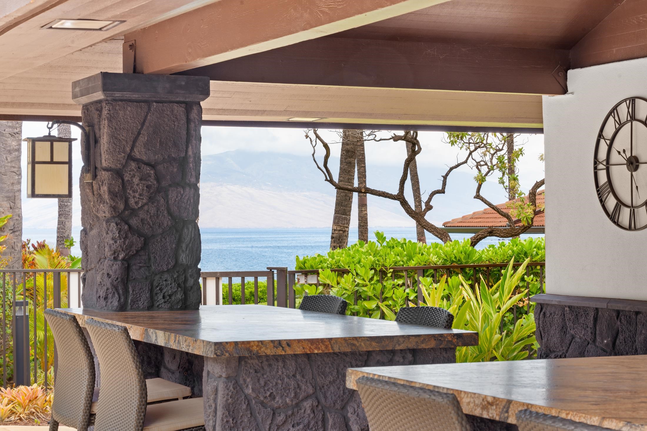4850 Makena Alanui Road, Unit C106 Kihei, HI 96753 - Photo 41 of 49 a wooden floor with table and chairs