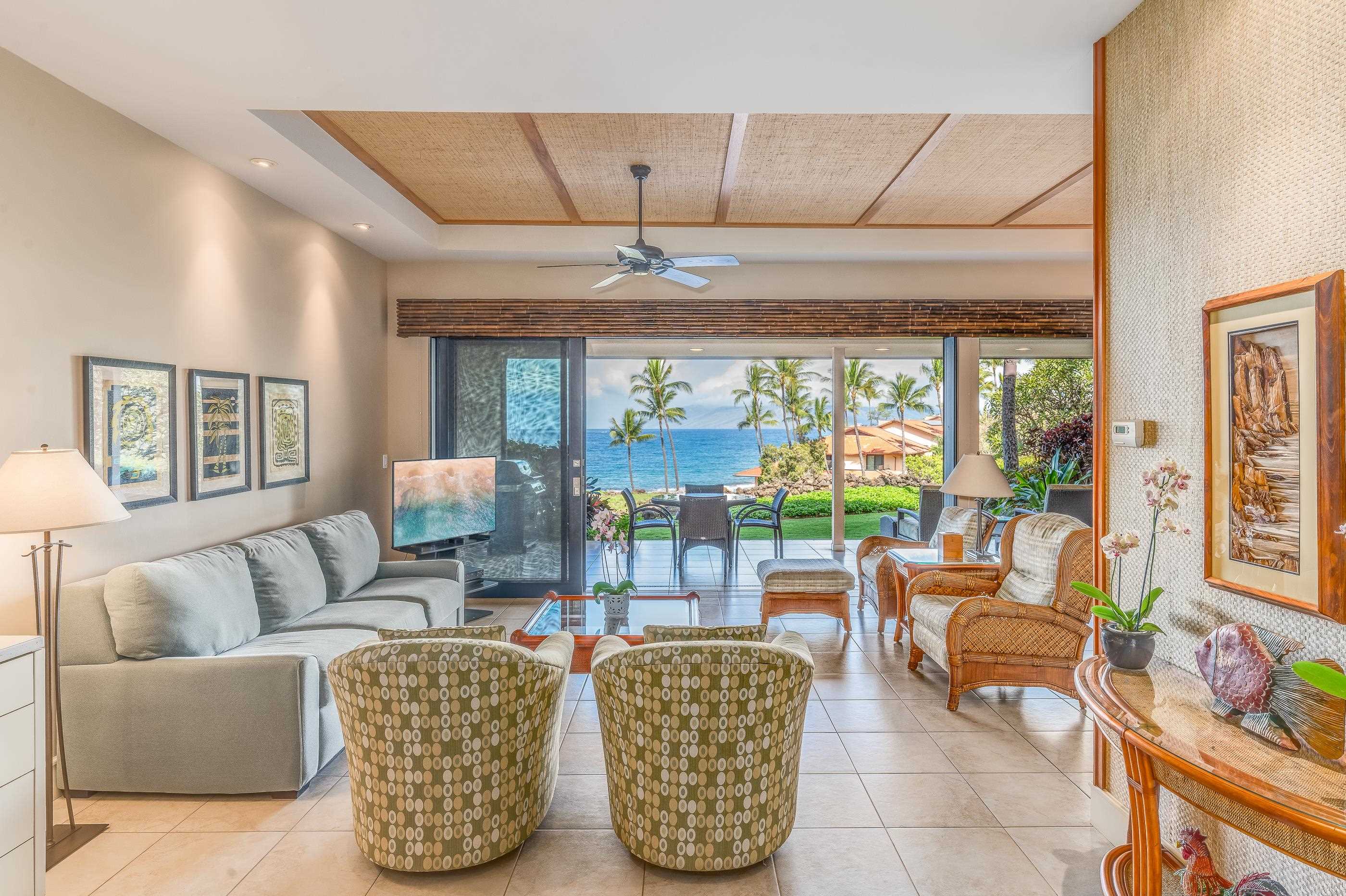 4850 Makena Alanui Road, Unit C106 Kihei, HI 96753 - Photo 9 of 49 a living room with furniture and a large window