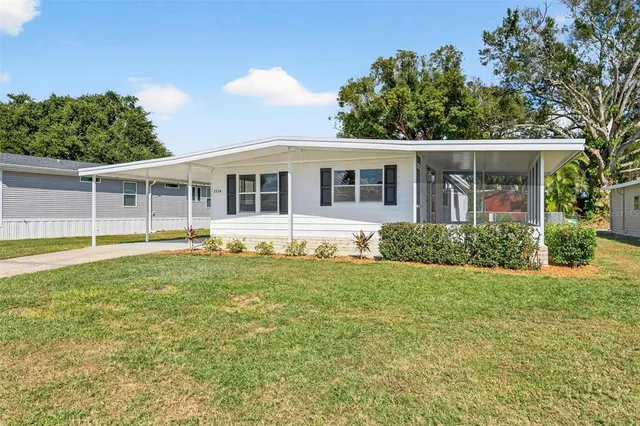 front view of a house with a yard