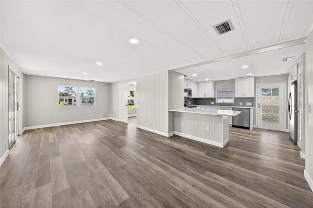 a view of kitchen with wooden floor