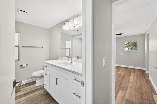 a bathroom with a sink a vanity and a mirror