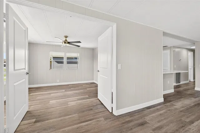 a view of a house with backyard and garden