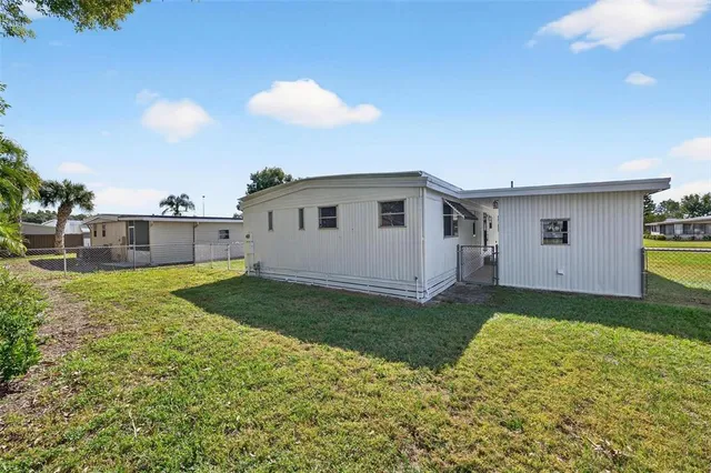 an aerial view of a house with a lake view