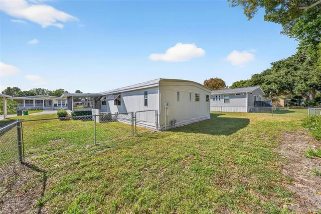 an aerial view of a house with a swimming pool