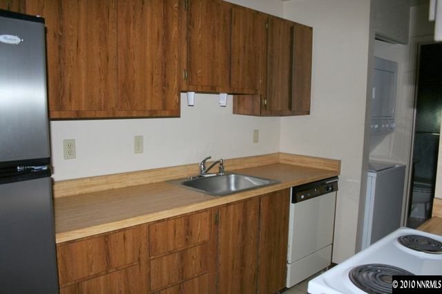 4394 Matich Drive Reno, NV 89502 - Photo 5 of 8 a kitchen with a sink and cabinets