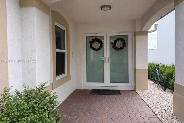 a bed room with furniture and a flat screen tv