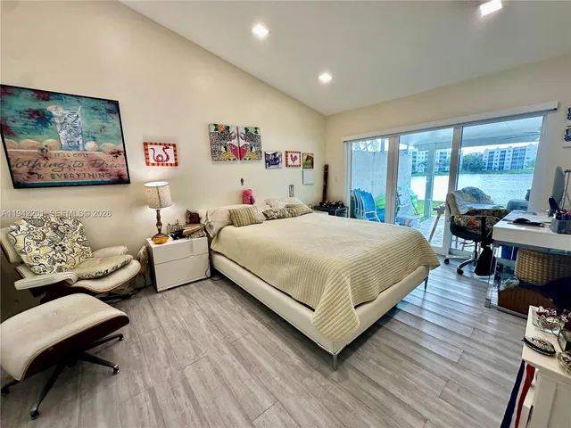 a view of a swimming pool with a table and chairs