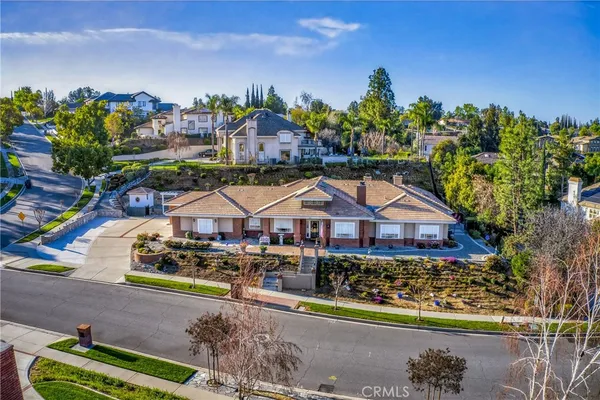 an aerial view of a house with a garden