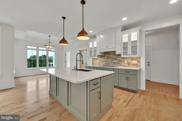 a kitchen with a sink cabinets and window