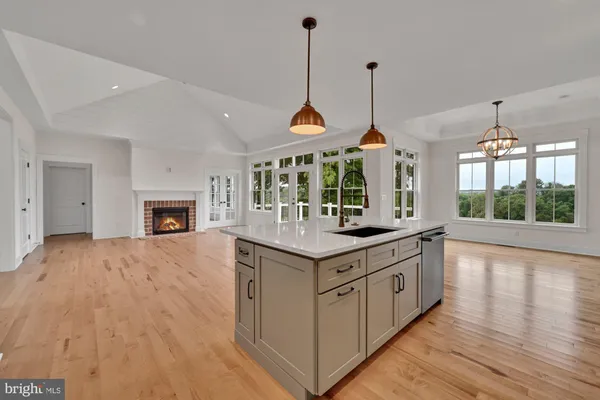 a kitchen with kitchen island and a wooden floors