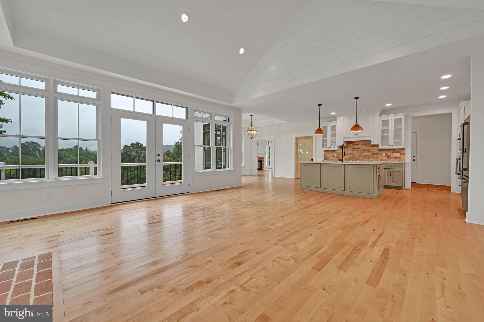 786 Fairview Road Mount Joy, PA 17552 - Photo 9 of 45 a view of a big room with wooden floor and windows