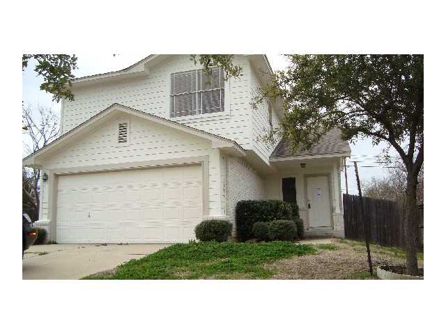 1500 Merrell Cove Round Rock, TX 78664 - Photo 1 of 1 a front view of a house with a yard and garage