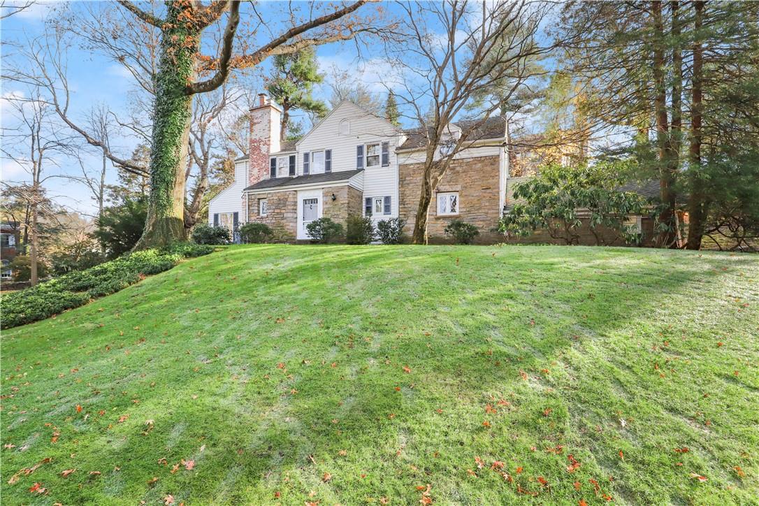 a view of a house with a big yard