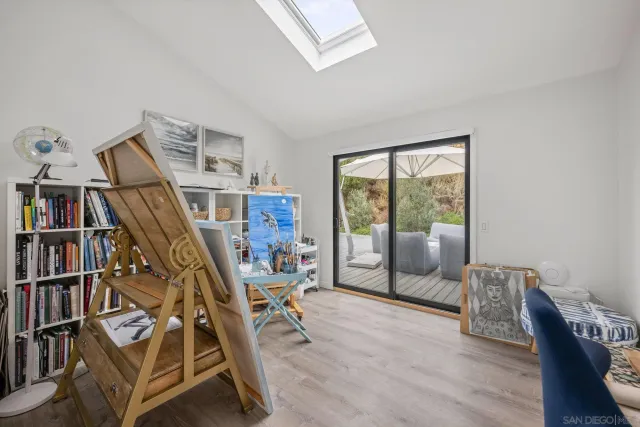 a view of a livingroom with furniture and staircase
