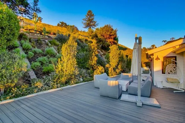 a view of a chair and tables on the wooden floor