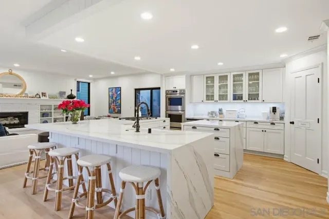 a kitchen with stainless steel appliances kitchen island granite countertop a sink and cabinets