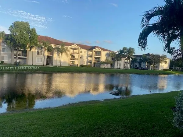 a view of a lake with a building in the background