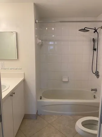 a bathroom with a shower a bathtub and a sink