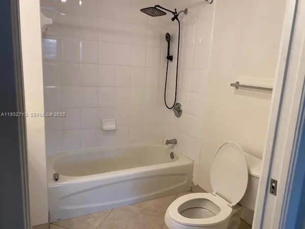 a bathroom with a sink a toilet and a bathtub