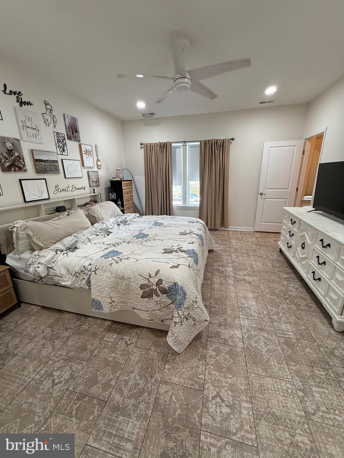314 Iannelli Road Clarksboro, NJ 08020 - Photo 16 of 29 a spacious bedroom with a bed a mirror on dresser and a flat screen tv