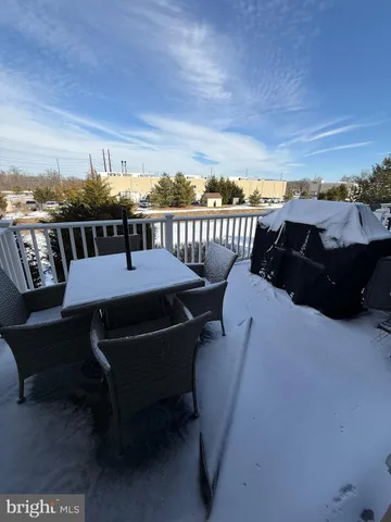 a view of a balcony with table and chairs
