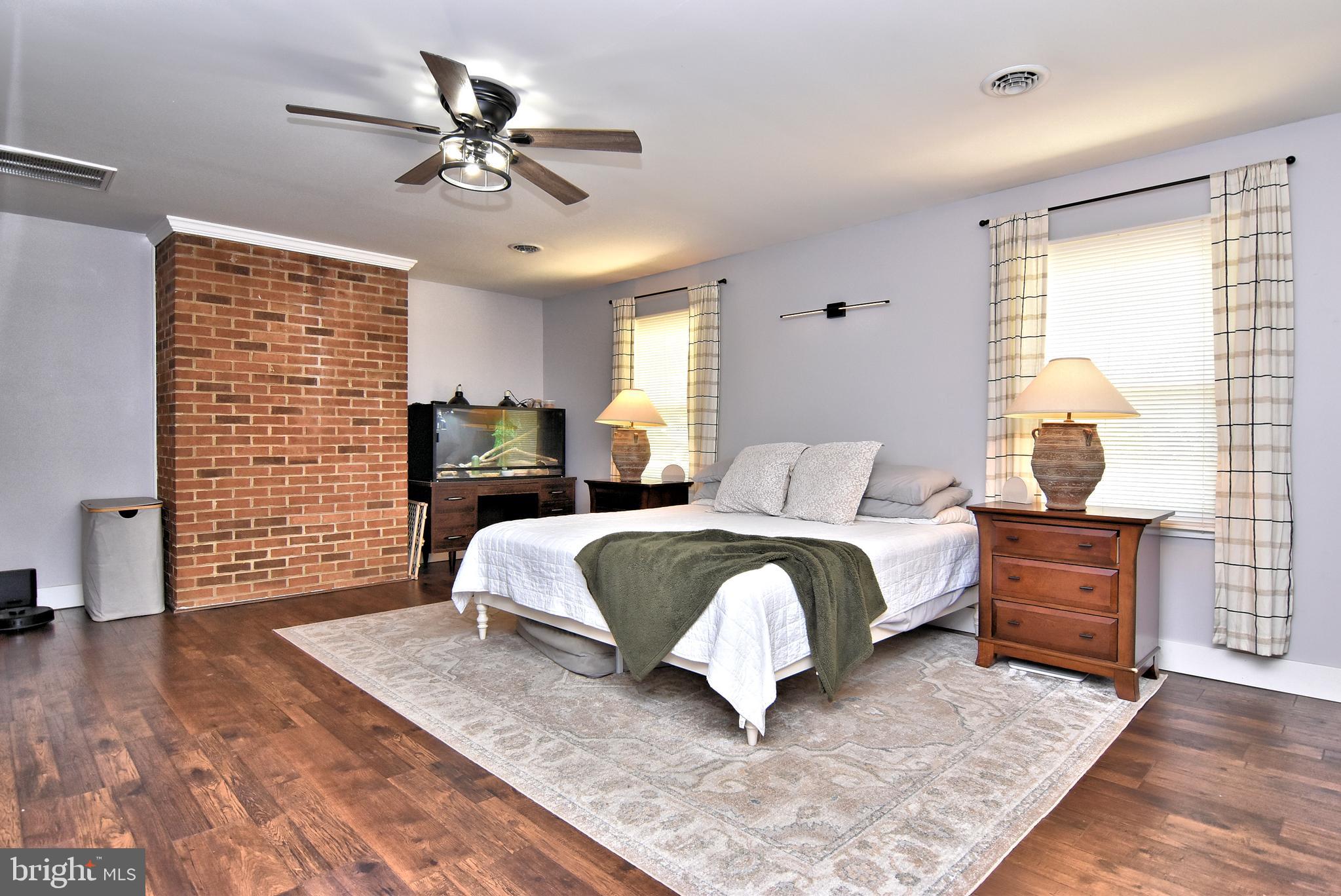 9012 Concord Road Seaford, DE 19973 - Photo 15 of 24 a bedroom with a large bed and a window