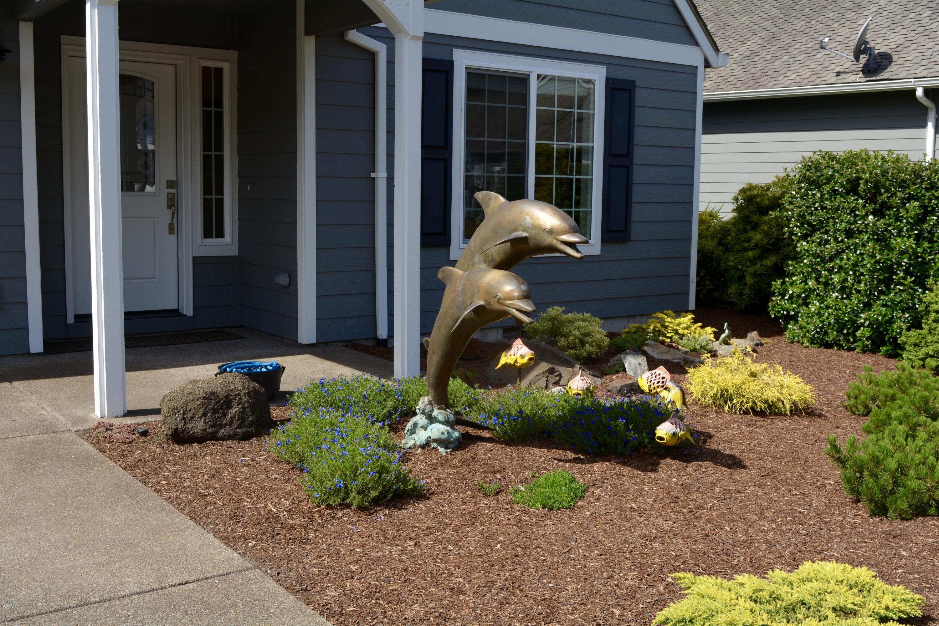 145 Southwest 61 Street Newport, OR 97366 - Photo 3 of 33 Dolphin Sculpture
