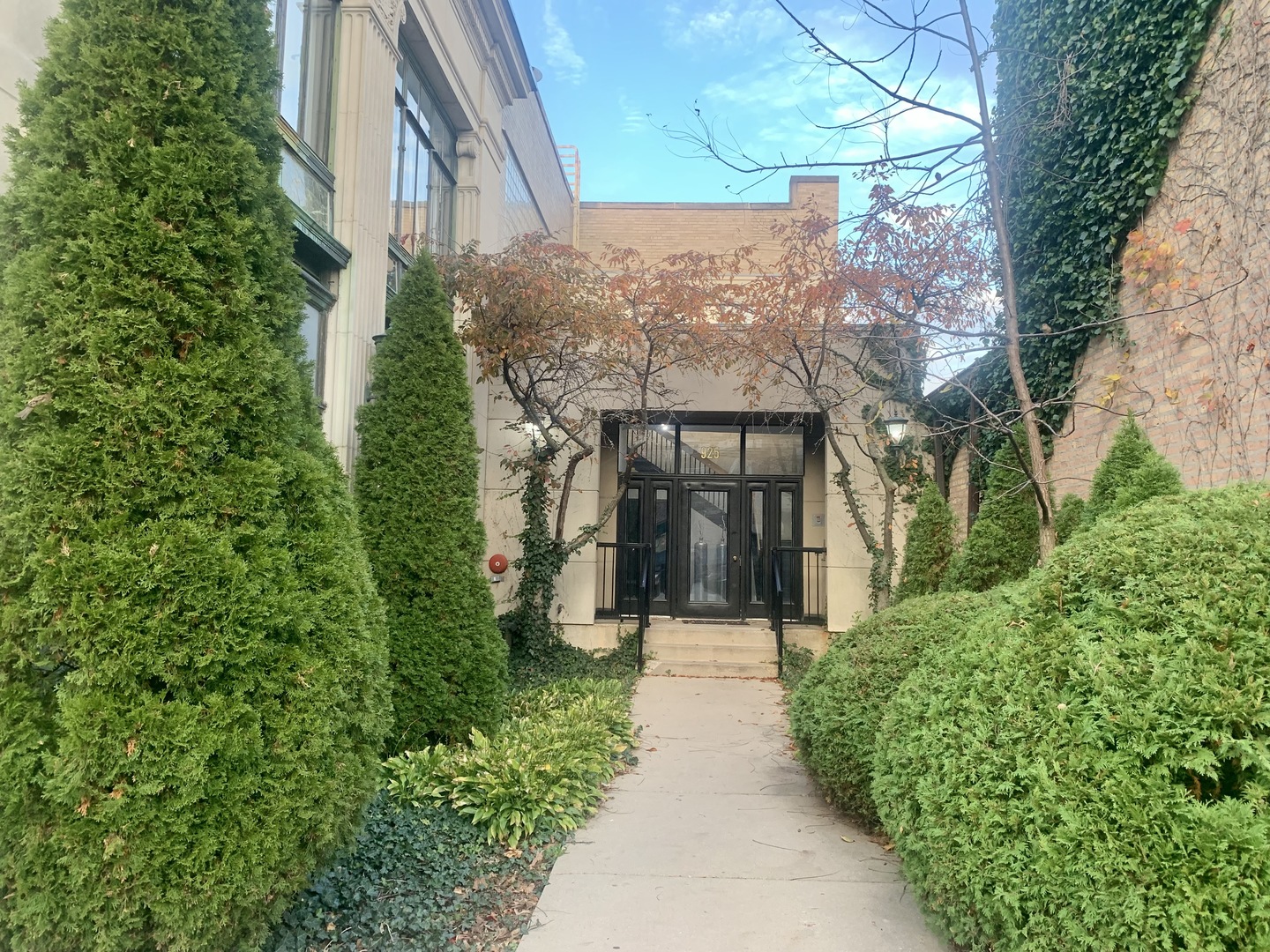 a view of a pathway both side of house