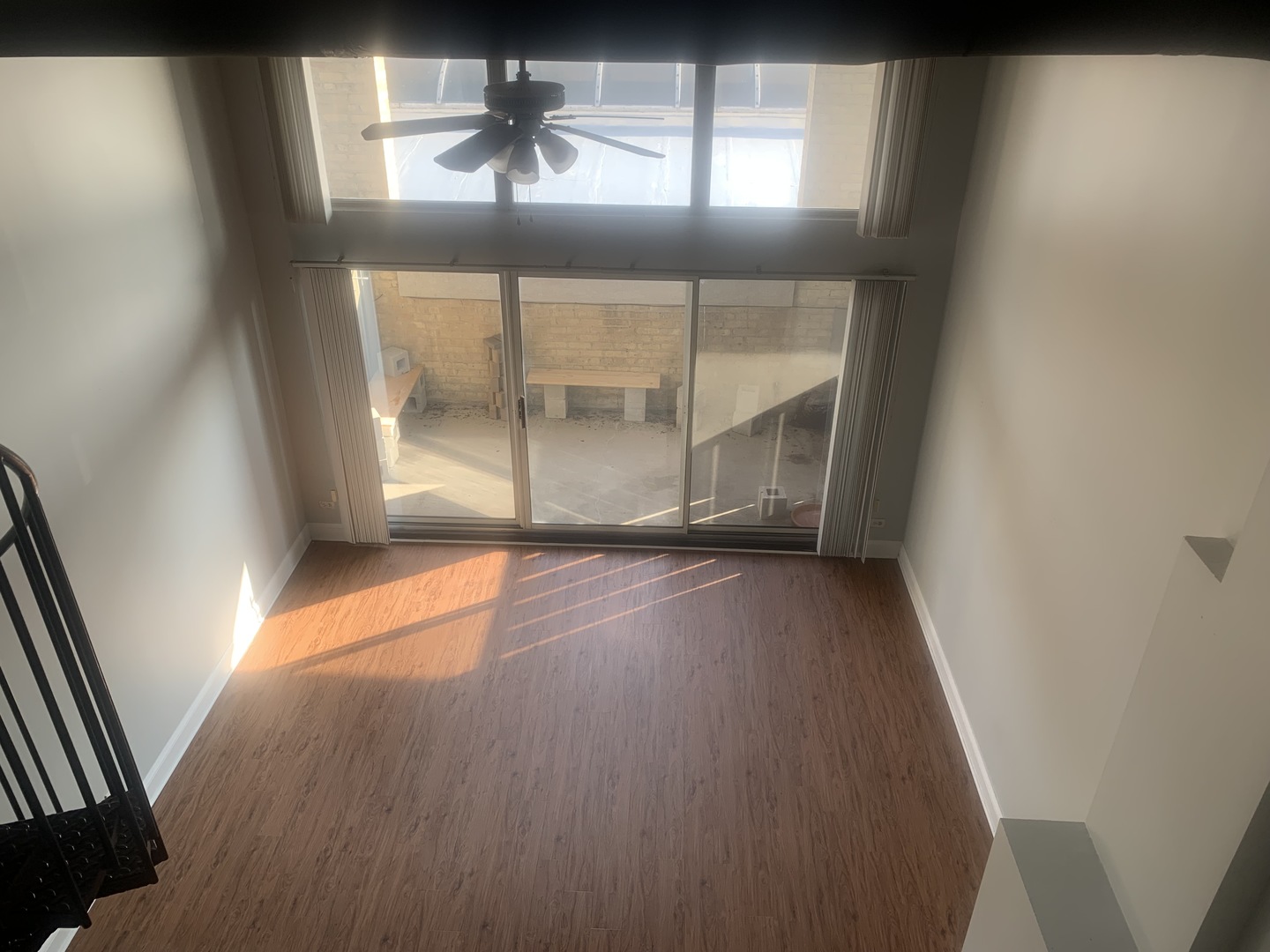 925 Green Bay Road, Unit 18 Winnetka, IL 60093 - Photo 6 of 10 an empty room with wooden floor and windows