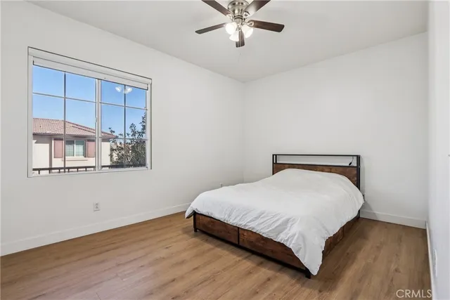 a bedroom with a bed and window
