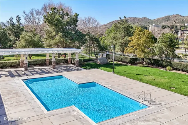 a view of a swimming pool with a patio