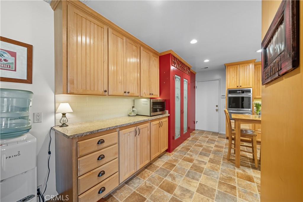 1181 Gearald Way Fallbrook, CA 92028 - Photo 13 of 39 a kitchen with stainless steel appliances a sink stove and refrigerator