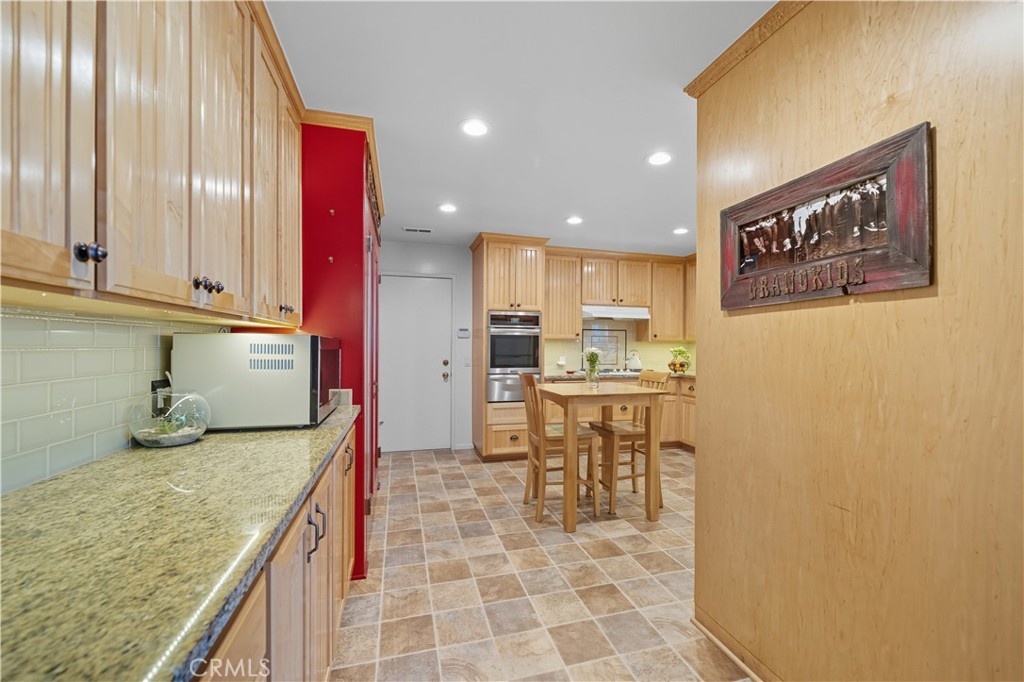 1181 Gearald Way Fallbrook, CA 92028 - Photo 14 of 39 a kitchen with a cabinets and chairs