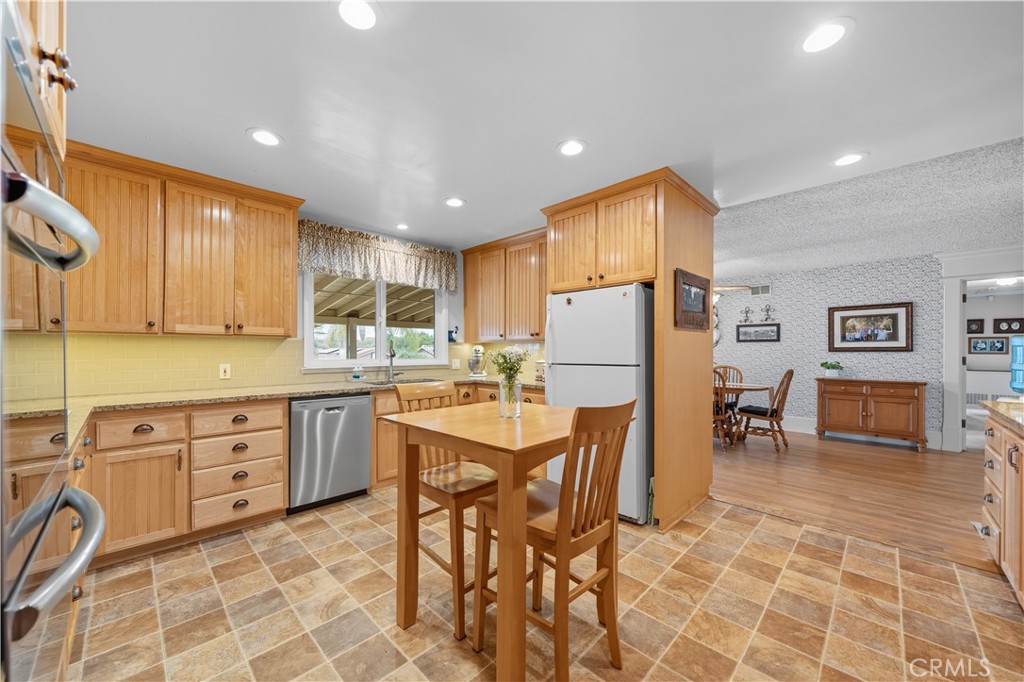 1181 Gearald Way Fallbrook, CA 92028 - Photo 16 of 39 a kitchen with sink cabinets and refrigerator