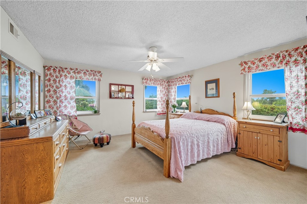 1181 Gearald Way Fallbrook, CA 92028 - Photo 20 of 39 a bed room with a bed and a couch