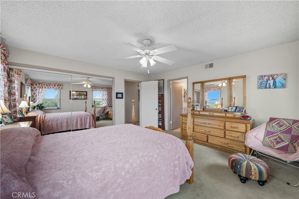 1181 Gearald Way Fallbrook, CA 92028 - Photo 22 of 39 a bedroom with furniture and a large window