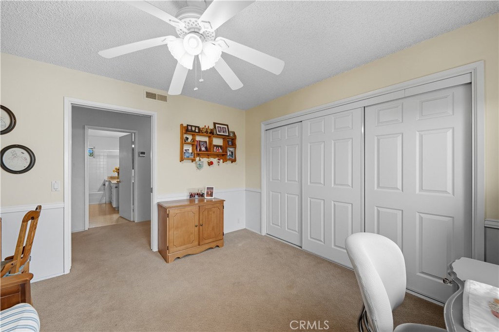 1181 Gearald Way Fallbrook, CA 92028 - Photo 25 of 39 a living room with furniture and a chandelier fan