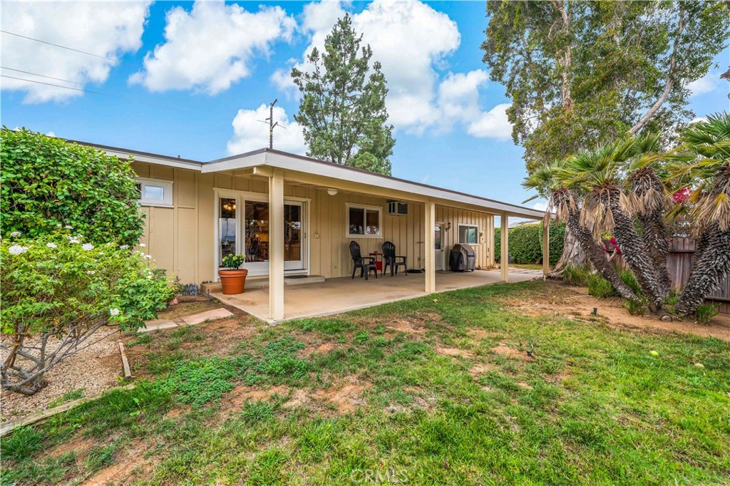 1181 Gearald Way Fallbrook, CA 92028 - Photo 31 of 39 a view of a house with backyard porch and garden
