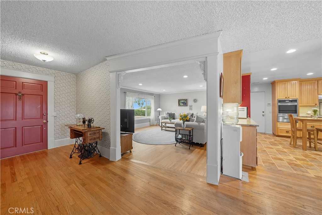 1181 Gearald Way Fallbrook, CA 92028 - Photo 5 of 39 a living room with furniture and a wooden floor