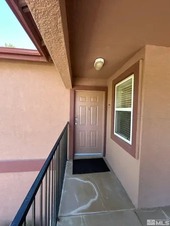 a view of a house with stairs and a window