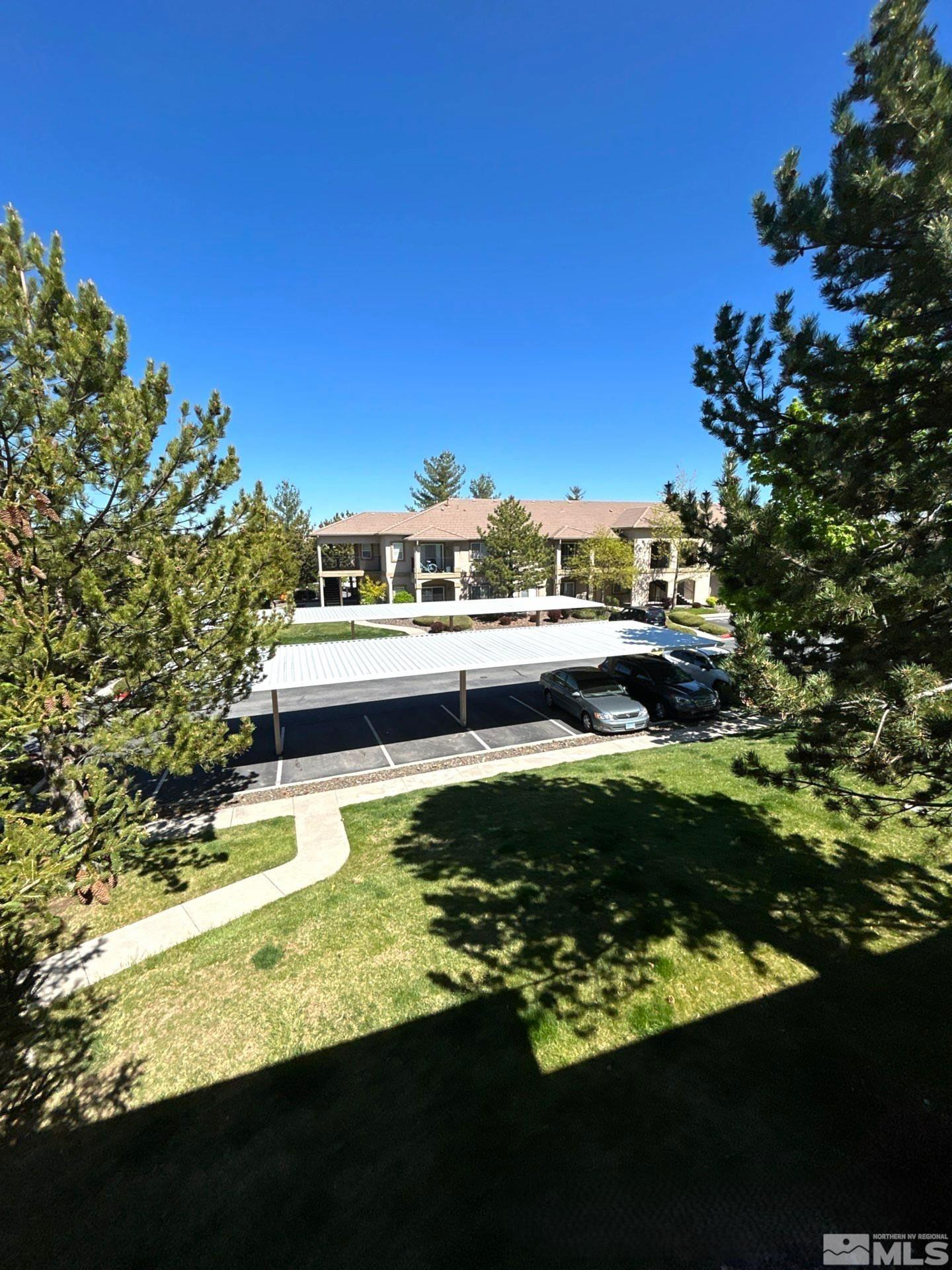 6850 Sharlands Avenue, Unit AB2170 Reno, NV 89523 - Photo 15 of 16 a view of swimming pool from a yard