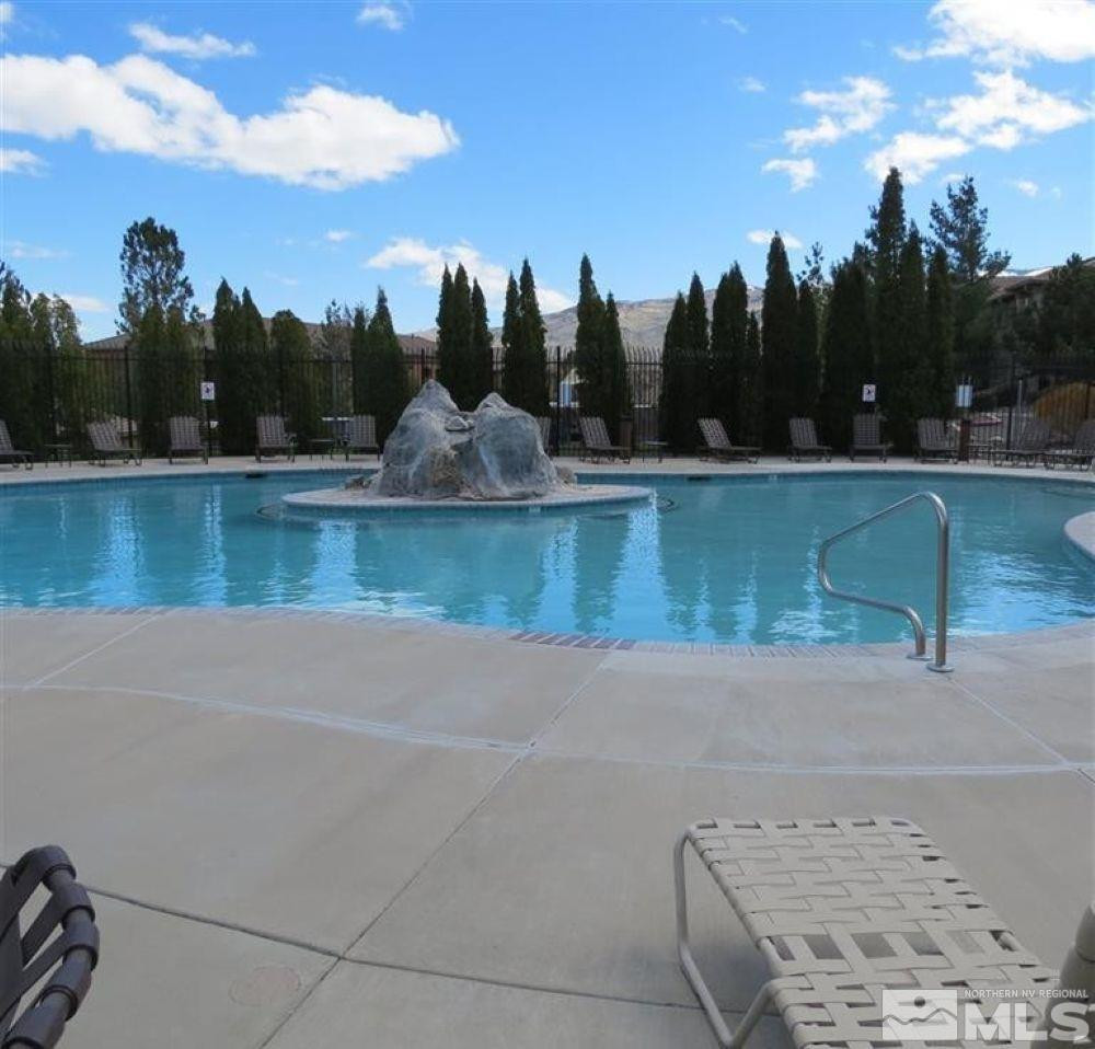 6850 Sharlands Avenue, Unit AB2170 Reno, NV 89523 - Photo 5 of 16 a view of a lake with palm trees