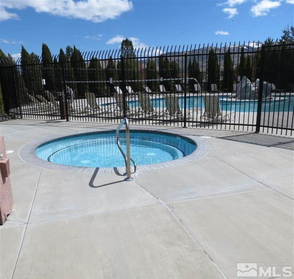 6850 Sharlands Avenue, Unit AB2170 Reno, NV 89523 - Photo 6 of 16 a view of swimming pool with outdoor seating and yard in the back