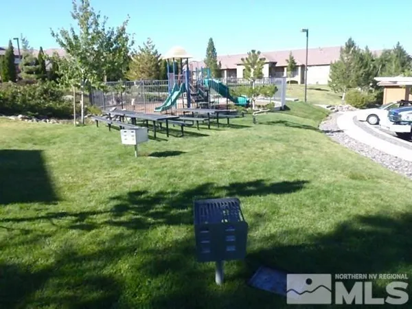 a swimming pool with outdoor seating and yard